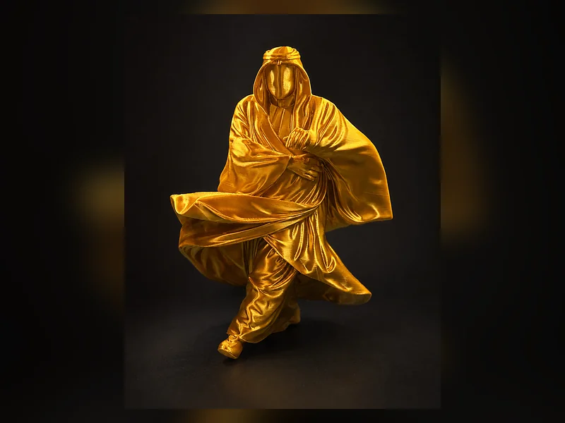 A printed statue of a cloak in glossy gold folds on a dark ground