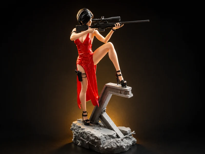 A character figure in a red dress in an aiming pose on a base of broken planks